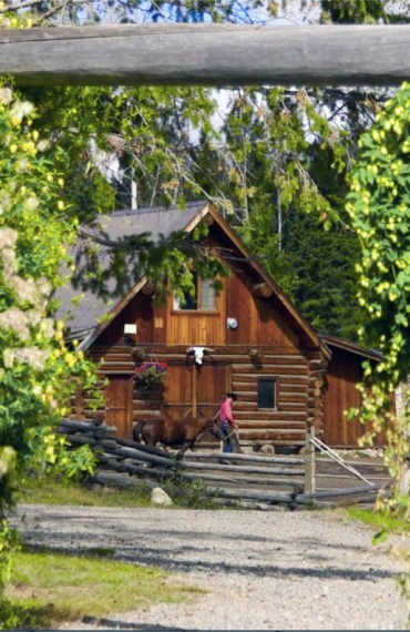 An authentic hand-hewn log barn accommodation - The Cariboo Barn Loft Suite